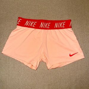Nike dry fit shorts in pale pink with elastic waste band.